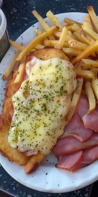 Delicious french fries with ham